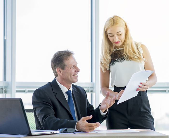 Medical record review services team writing a medical legal report in Ontario